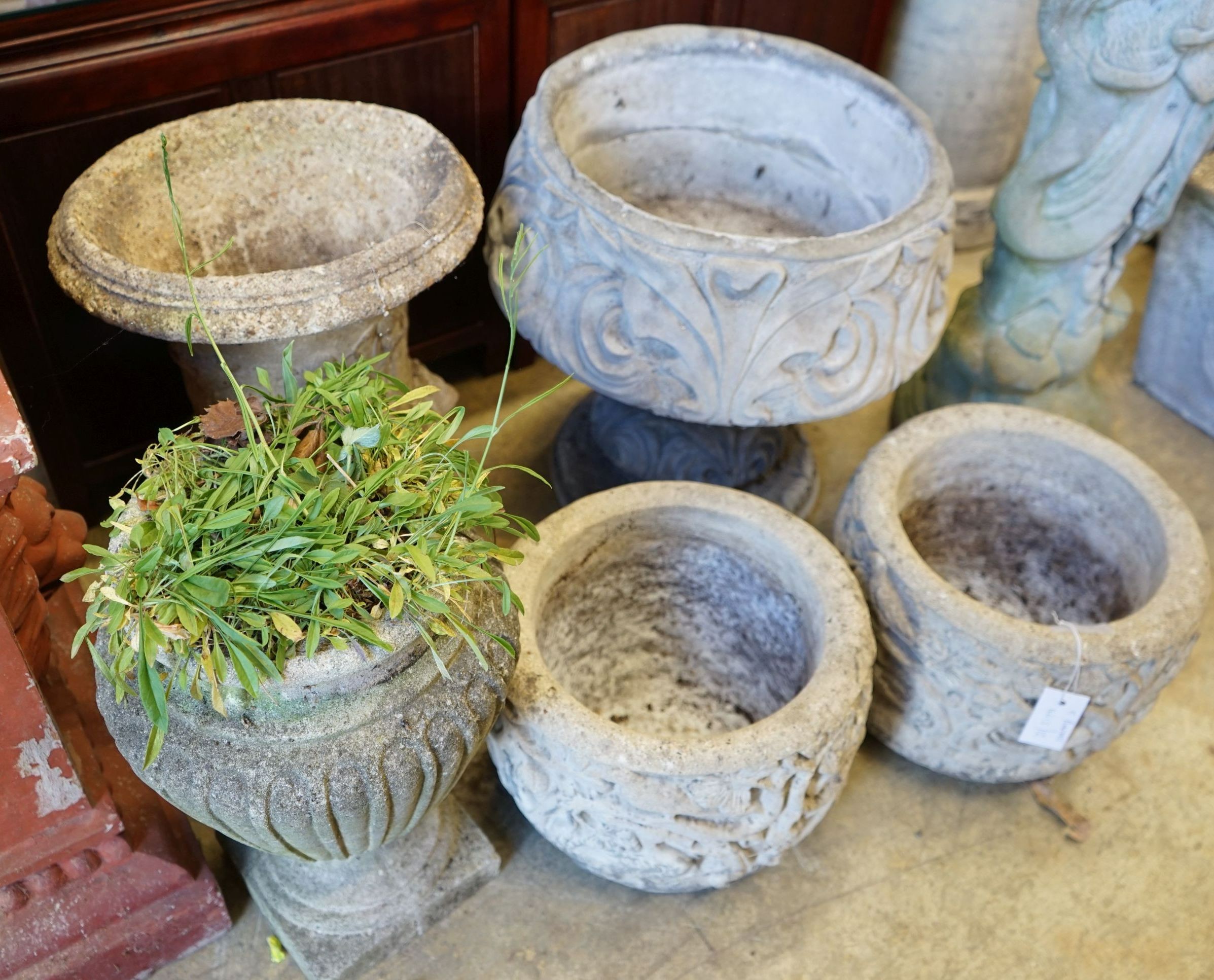 Five circular reconstituted stone garden planters, largest diameter 40cm, height 46cm